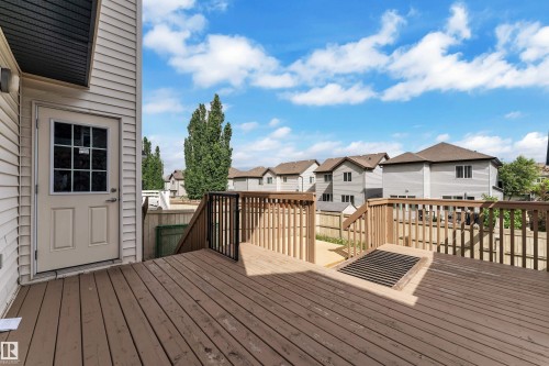 Spacious wood-finish deck with integrated railing system - 6116 11 Avenue, Edmonton, AB 