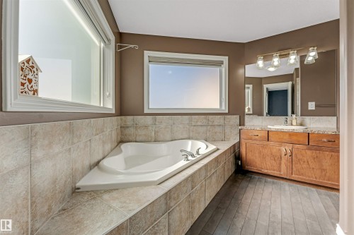 Corner soaking tub with tile surround and deck - 5928 12 Avenue, Edmonton, AB 