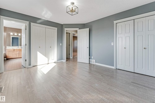 Spacious room with light-toned wood-finish flooring - 5928 12 Avenue, Edmonton, AB 