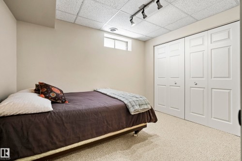Room featuring light-colored walls and soft carpet flooring - 3208 70 Street, Edmonton, AB 