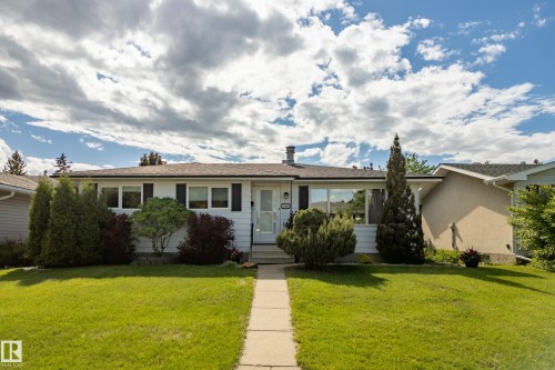 Ranch-style exterior with white siding and black shutters - 3208 70 Street, Edmonton, AB 