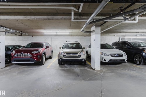Secured underground parking with concrete flooring and overhead lighting - 217 508 Griesbach Parade, Edmonton, AB 