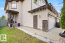 Two-story exterior with light-colored siding - 3756 8 Street, Edmonton, AB 