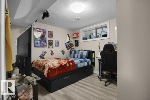 Room featuring light wood-finish flooring and neutral wall tones - 3756 8 Street, Edmonton, AB 