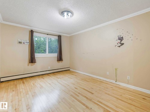 Hardwood-finish flooring enhancing the bright interior - 403 10165 113 Street, Edmonton, AB 