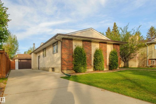 Exterior facade featuring brick accents and stucco siding - 58 Lodgepole Crescent, St. Albert, AB 
