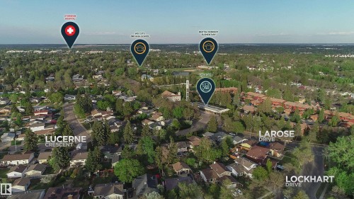 Aerial perspective showcasing a residential area with mature trees and established streets - 58 Lodgepole Crescent, St. Albert, AB 