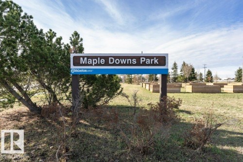 Park signage featuring a brown and blue information board - 233 Oak Wood Drive, Edmonton, AB 