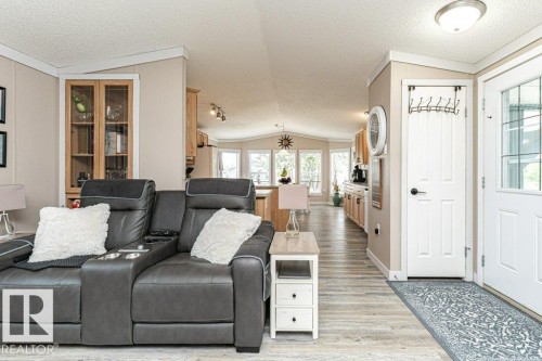 Open concept living area featuring wood-finish flooring - 233 Oak Wood Drive, Edmonton, AB 