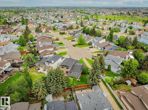 Aerial perspective showcasing a residential area with varied home styles and mature landscaping - 15804 80 Street, Edmonton, AB 