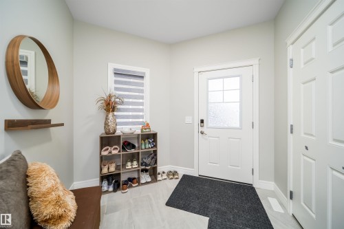 Entryway featuring light gray walls and tile flooring - 16123 31 Avenue, Edmonton, AB 