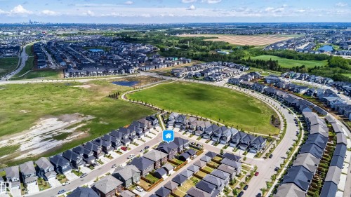 Aerial overview of a modern residential development featuring numerous detached and attached properties - 16123 31 Avenue, Edmonton, AB 