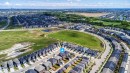 Aerial overview of a modern residential development featuring numerous detached and attached properties - 16123 31 Avenue, Edmonton, AB 