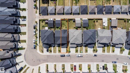 Aerial perspective of a residential neighborhood featuring uniform rooflines and paved roadways - 16123 31 Avenue, Edmonton, AB 