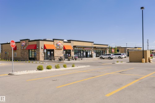Commercial retail building featuring stone veneer and stucco facade - 4228 162 Avenue, Edmonton, AB 