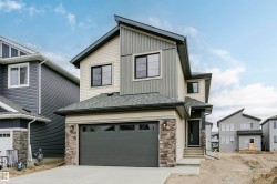 Modern exterior with varied siding textures and stone accents - 