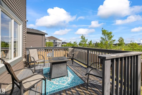 Expansive rear deck featuring a wood surface and perimeter railing - 607 40 Street, Edmonton, AB 