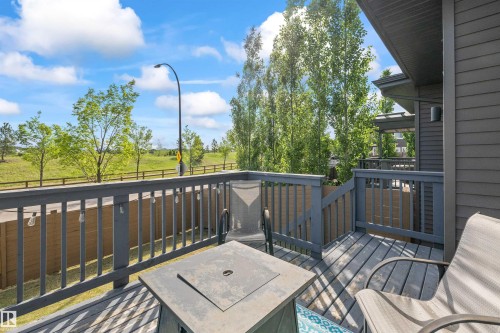 Outdoor deck featuring wood-finish flooring and a wood railing - 607 40 Street, Edmonton, AB 