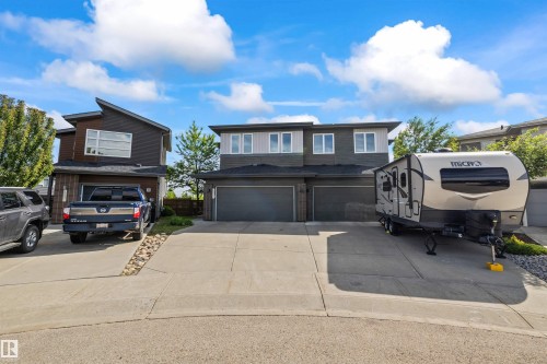 Contemporary duplex featuring a two-story design with a flat roofline - 607 40 Street, Edmonton, AB 