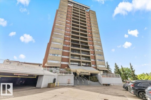 Multi-story residential building with a concrete and brown facade - 77 8735 165 Street, Edmonton, AB 