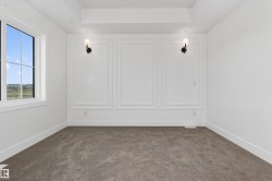 Interior room featuring white walls and a tray ceiling - 