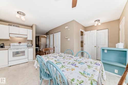 Dining area featuring light-toned flooring and neutral wall tones - 11831 9 Avenue, Edmonton, AB 