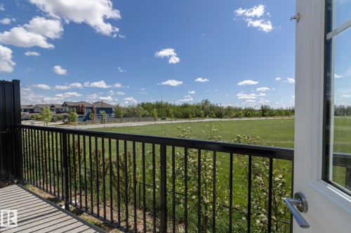 Balcony featuring a black iron railing and a concrete surface - 2610 Maple Way, Edmonton, AB 