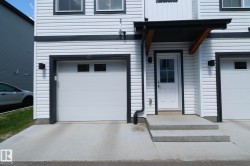White horizontal siding exterior with contrasting dark trim - 