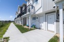 Row of multi-level properties with horizontal and vertical siding - 2610 Maple Way, Edmonton, AB 