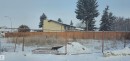 Fenced lot featuring a chain-link fence at the foreground and a privacy fence at the rear - 6004 19A Avenue Nw, Edmonton, AB 