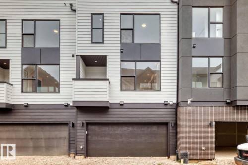 Contemporary exterior featuring light horizontal siding and dark architectural accents - #67 5 Rondeau Dr, St. Albert, AB - Outdoor