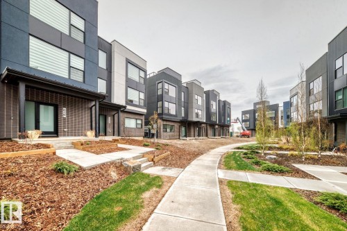 Modern multi-level exterior architecture featuring broad windows and a covered entry - #67 5 Rondeau Dr, St. Albert, AB - Outdoor