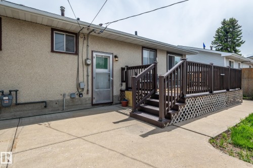 Rear exterior with a concrete patio - 13816 62 Street, Edmonton, AB 