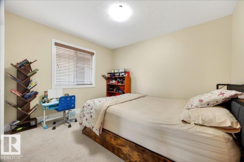 Room with neutral-toned walls and light-colored carpet flooring - 1411 30 Avenue, Edmonton, AB 