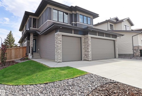 Contemporary exterior featuring horizontal siding, stone accents, and dark trim - 100 Graybriar Drive, Stony Plain, AB - Outdoor