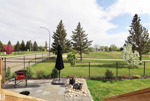 Professionally designed low maintenance backyard - 100 Graybriar Drive, Stony Plain, AB - Outdoor With View