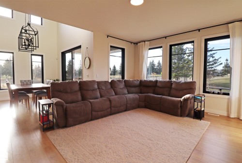 Open-concept living featuring 18' ceiling in the dining area. - 100 Graybriar Drive, Stony Plain, AB - Indoor Photo Showing Living Room