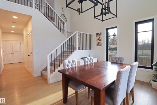 Dining area featuring a sliding glass patio door, leading to the south facing covered deck. - 100 Graybriar Drive, Stony Plain, AB - Indoor Photo Showing Dining Room