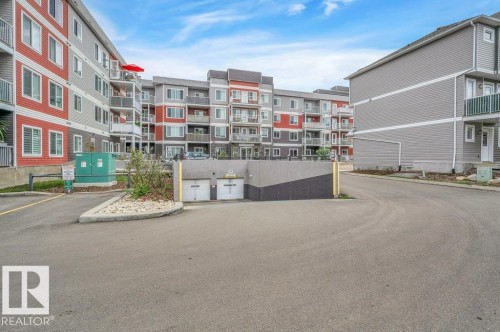 Multi-story residential buildings featuring varied siding colors and private balconies - 219 1820 Rutherford Road, Edmonton, AB 