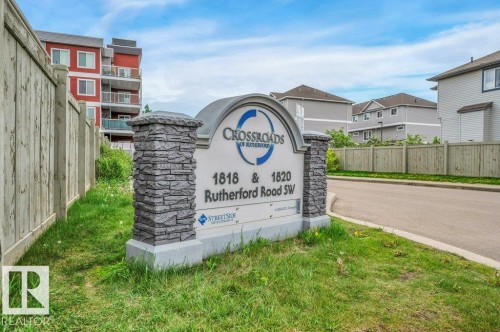 Monument sign featuring stone-look columns and arched top - 219 1820 Rutherford Road, Edmonton, AB 
