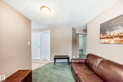 Recessed lighting illuminates the textured ceiling - 
