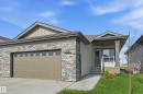 Stone veneer and siding exterior with a covered entry porch - 27 11 Dalton Link, Spruce Grove, AB 
