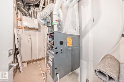 Furnace and ductwork system with an attached humidifier - #66 5 Rondeau Dr, St. Albert, AB - Indoor Photo Showing Basement