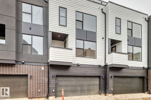 Modern townhome exteriors featuring multi-level construction - #66 5 Rondeau Dr, St. Albert, AB - Outdoor With Exterior