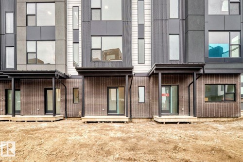 Contemporary townhouse exteriors featuring a blend of brick and panel siding - #66 5 Rondeau Dr, St. Albert, AB - Outdoor