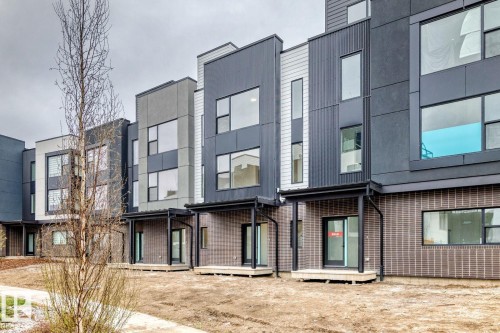 Contemporary multi-story facades featuring contrasting dark and light paneling - #66 5 Rondeau Dr, St. Albert, AB - Outdoor
