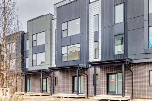 Contemporary townhome exterior featuring multi-textured facade - #66 5 Rondeau Dr, St. Albert, AB - Outdoor