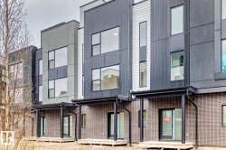 Contemporary townhome exterior featuring multi-textured facade - 
