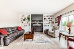 Built-in shelving flanking a textured fireplace - 