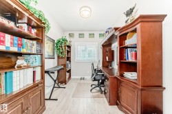 Dedicated office space featuring light wood-finish flooring - 